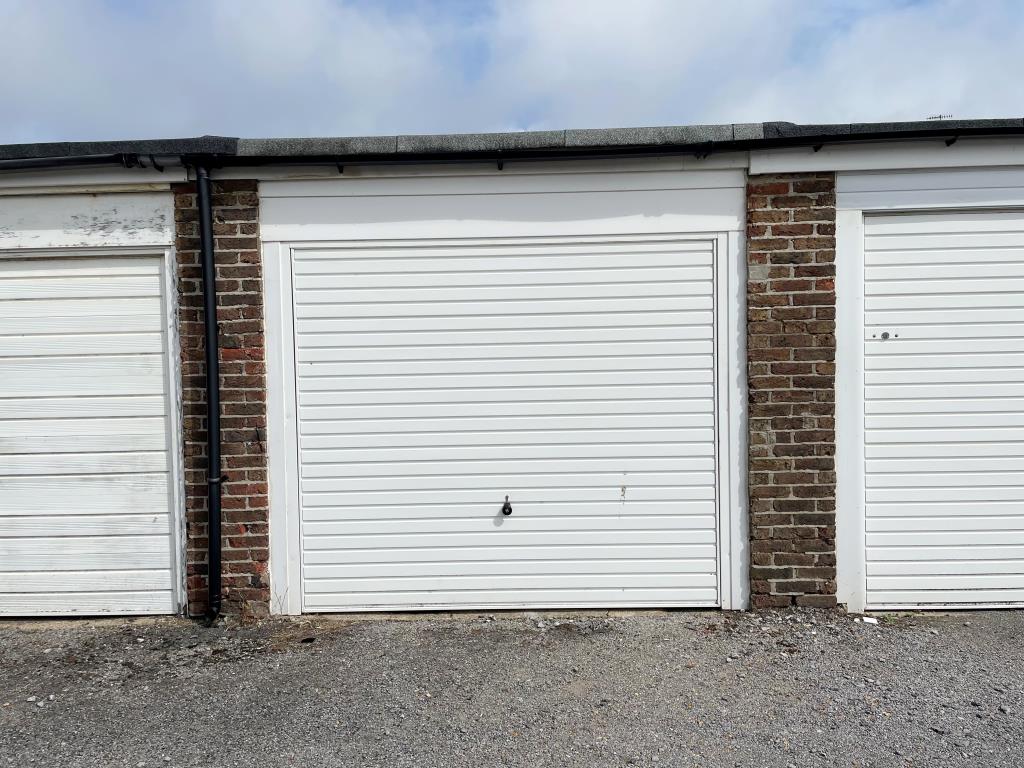 Lot: 36 - FREEHOLD LOCK-UP GARAGE JUST OFF HOVE SEAFRONT - front photo of garage with up and over door